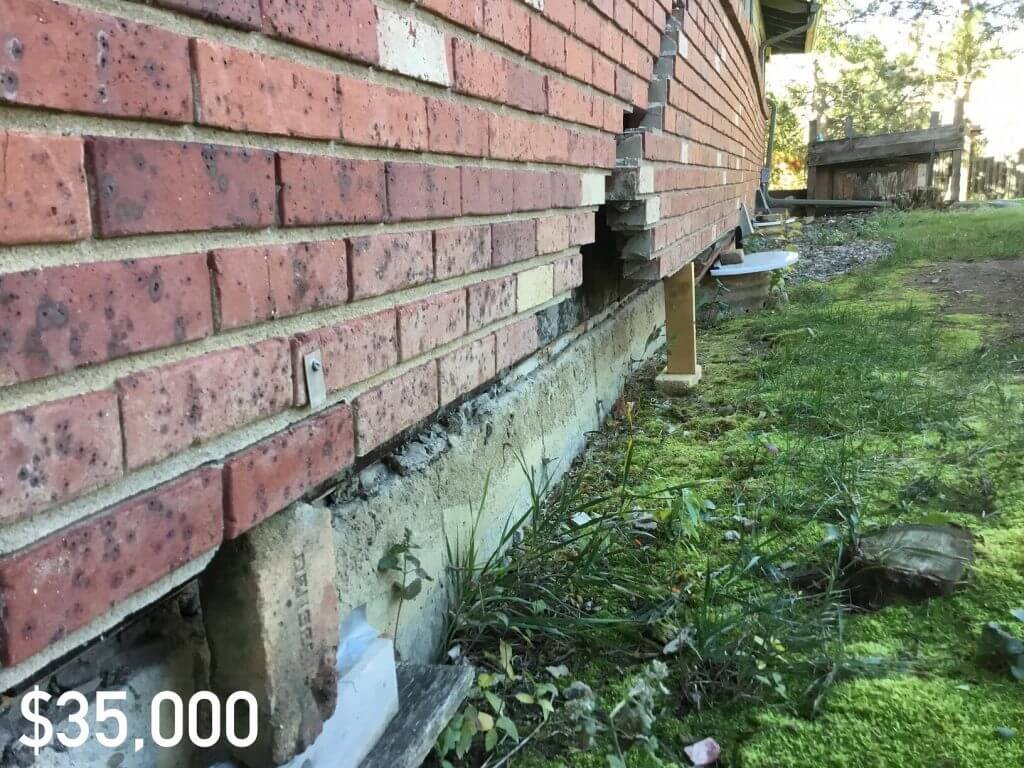 Large crack in brick wall on the exterior of a house