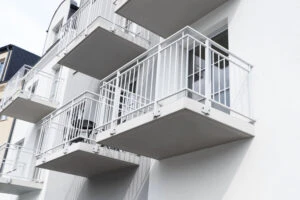 Structural engineer inspecting California apartment balconies for SB 721 and SB 326 exterior elevated elements safety compliance.