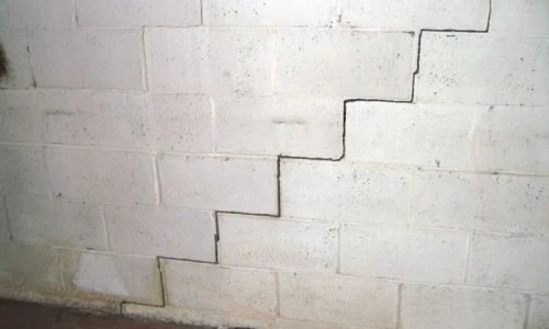 white brick wall crack